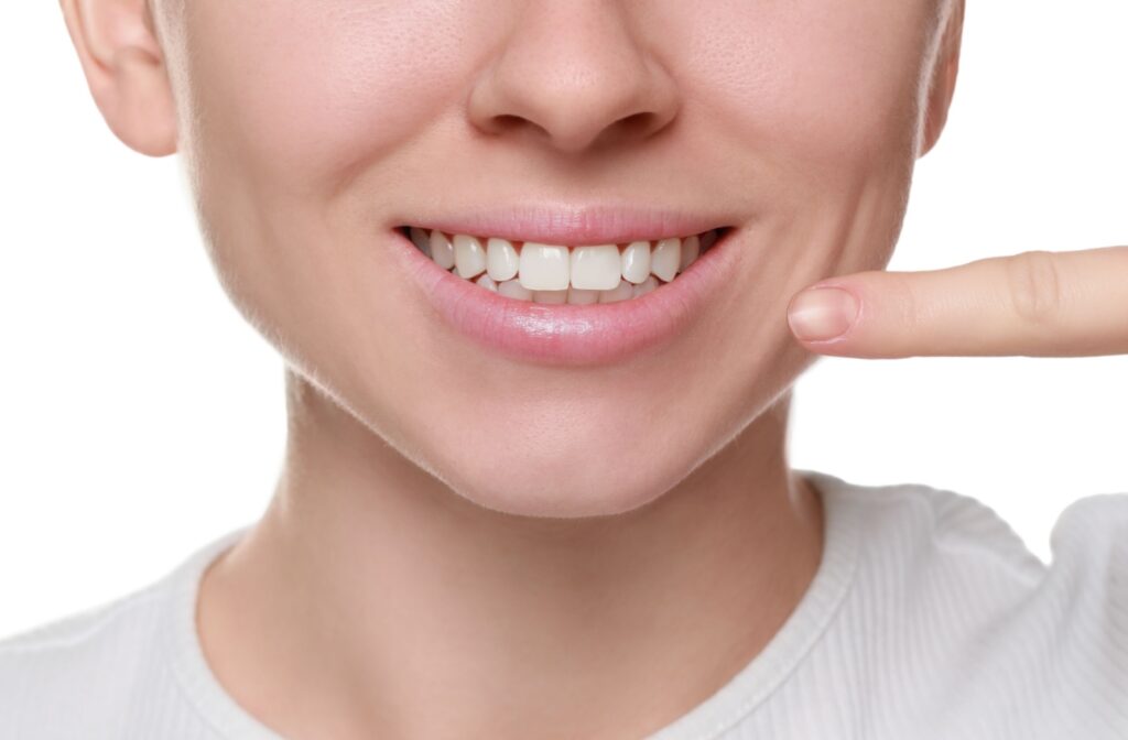 Someone shows off their healthy, stain free teeth.