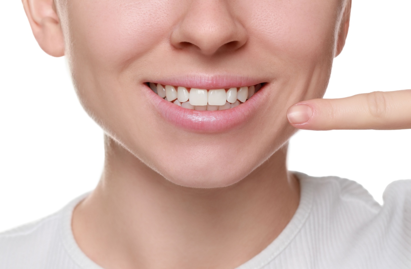 Someone shows off their healthy, stain free teeth.